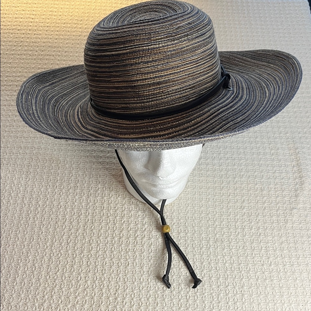 Sloggers sunhat, woven brown, tan, cream fiber w leather-like strap/wooden bead